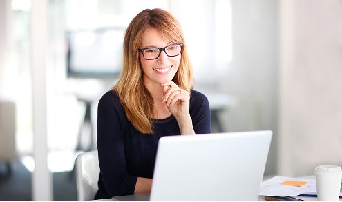 happy woman watching laptop screen using simple financial system happy woman watching laptop screen using simple financial system